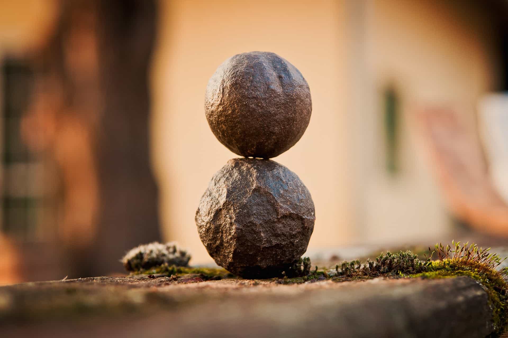 A pair of nuts are sitting on top of each other