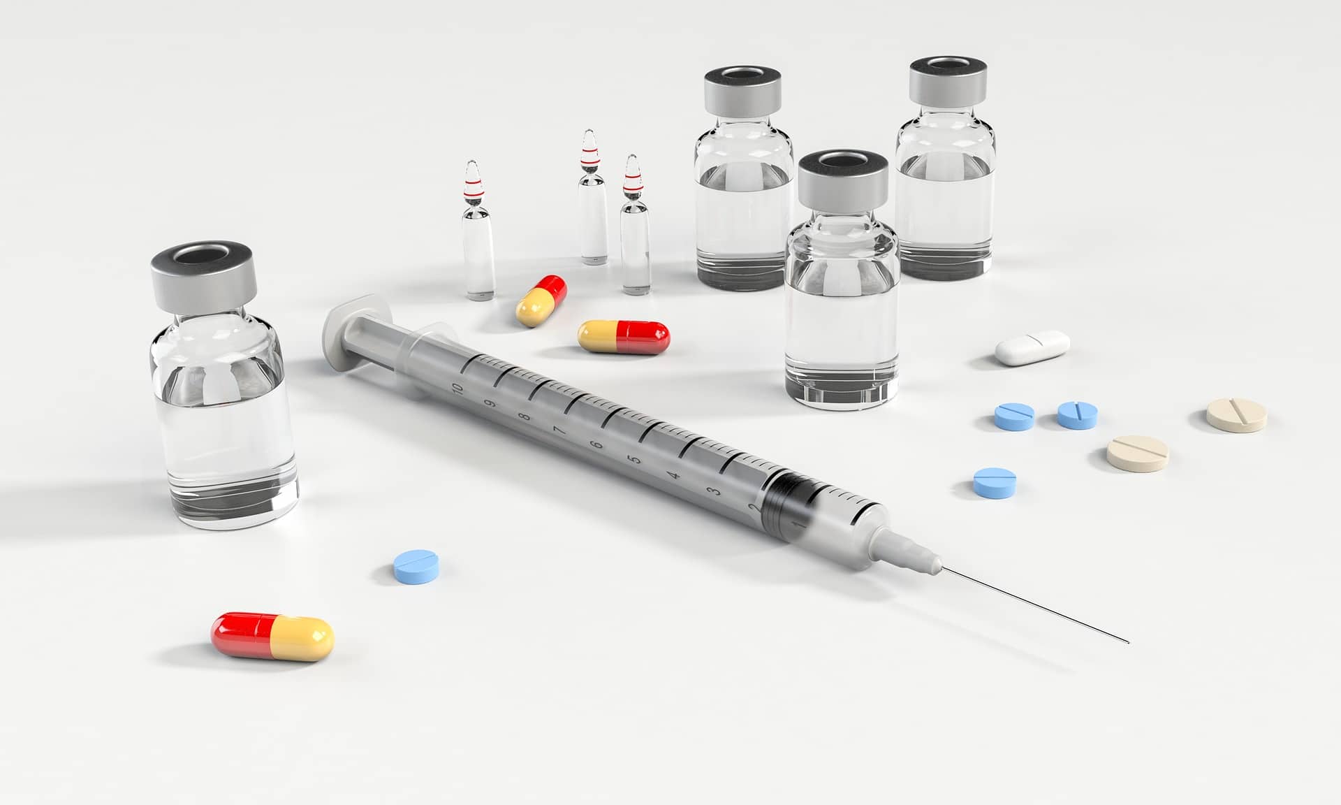 A syringe, pills and other medical supplies