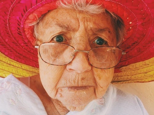 old lady in sun hat