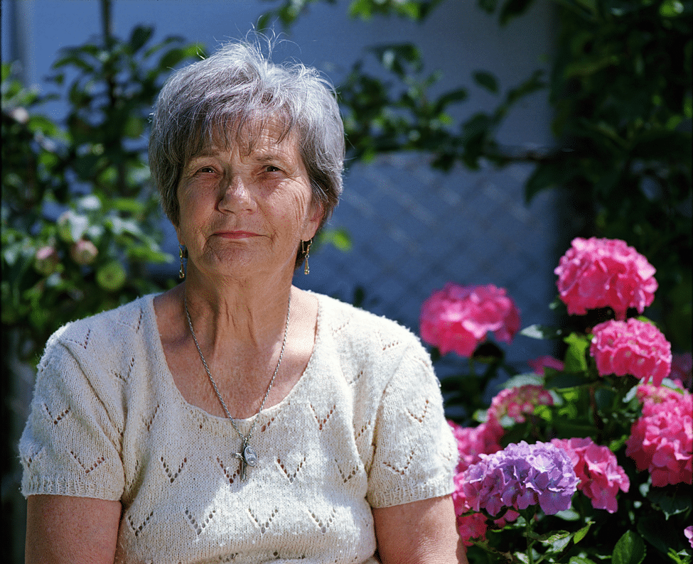 elderly-woman-sitting-outside-skin